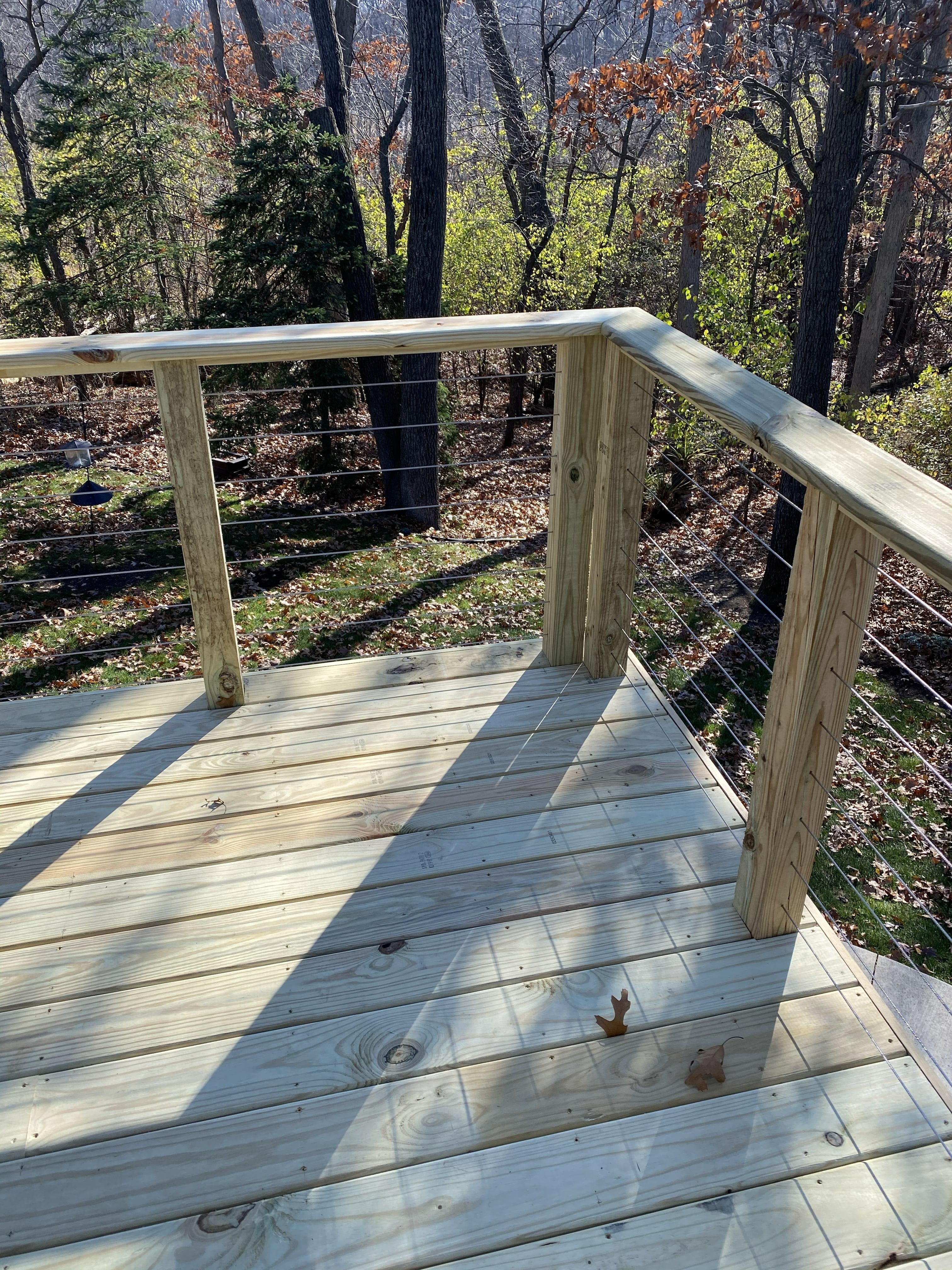 Wood Deck with Cable Wire Railing : Wooded Setting