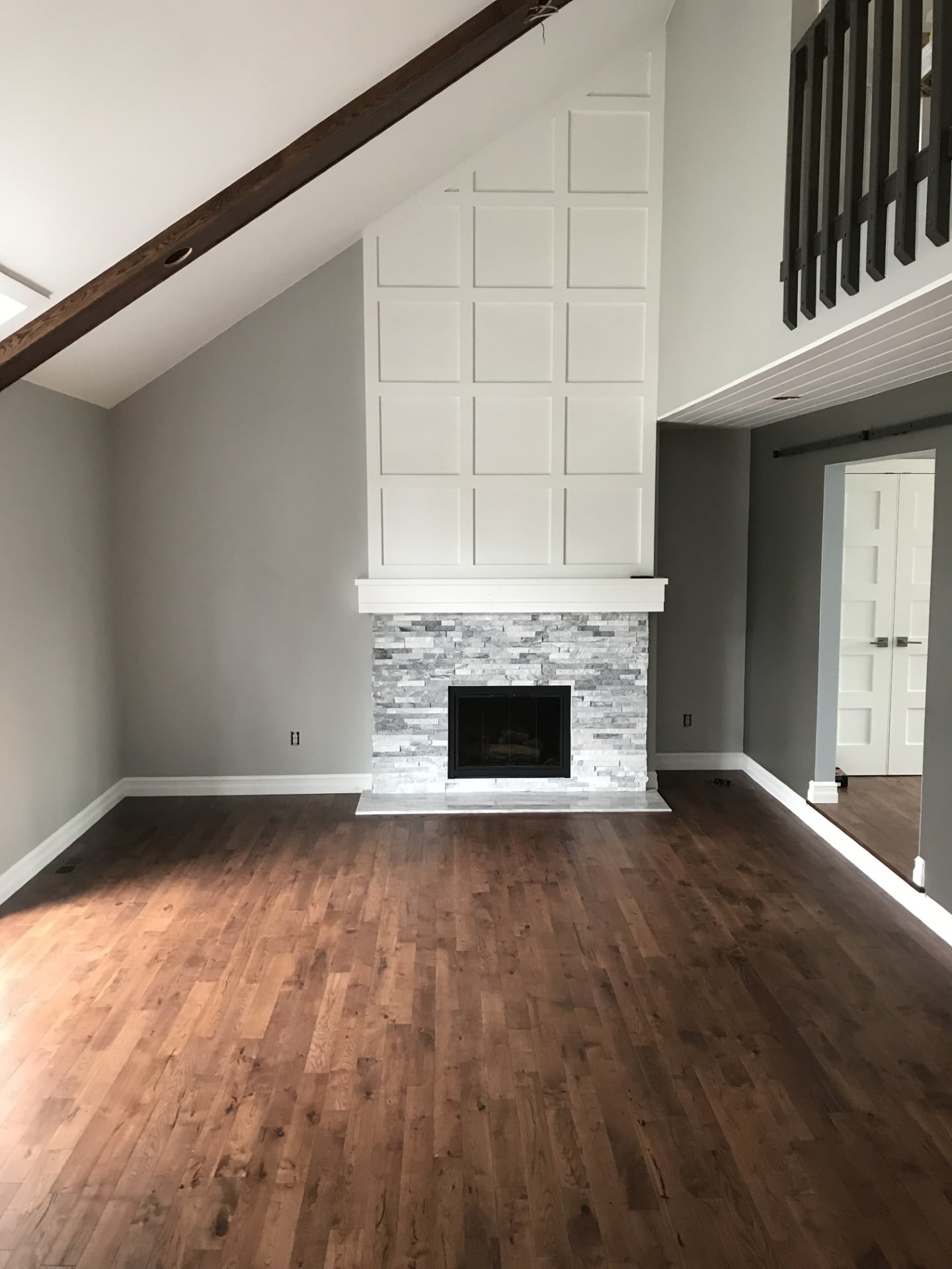 Living Room Renovation : Painted Brick Fireplace, White Shiplap & Dark Timber Beam by JD Contracting LLC